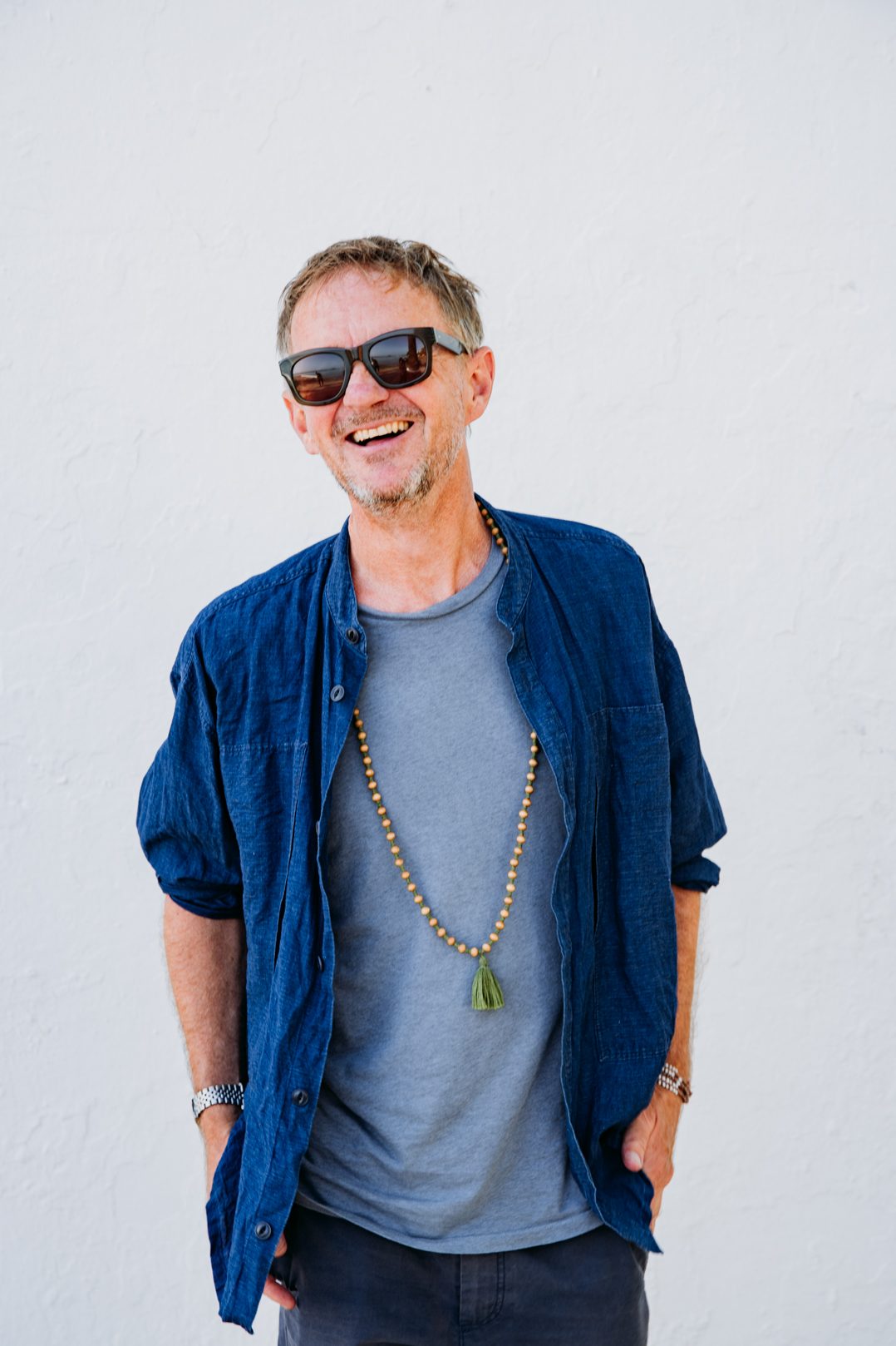 Portrait of Chris Coco in sunglasses and a blue shirt