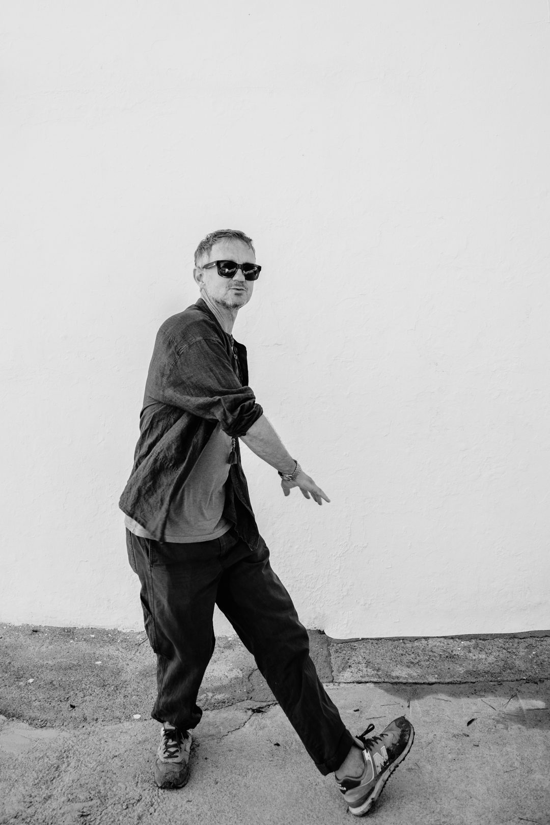 Black and white photo of Chris Coco mid-stride